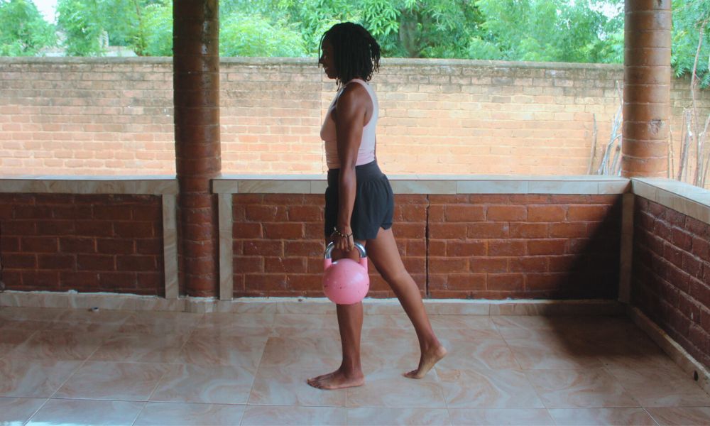 An image demonstrating the kettlebell move called a Farmer's Hold