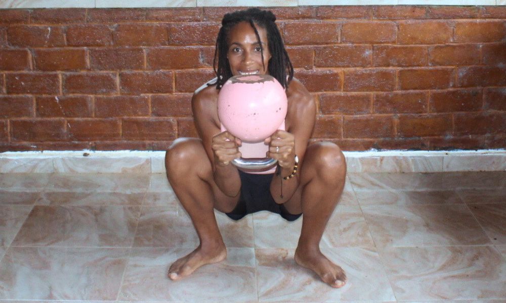 An image demonstrating a kettlebell move called the Goblet squat